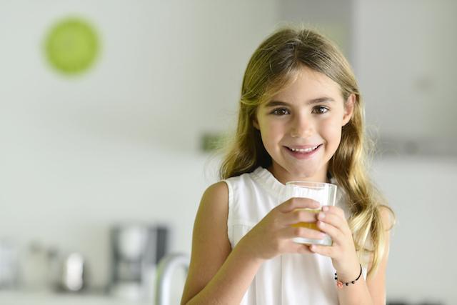 young girl in kitchen smiling I hospital sedation decatur il