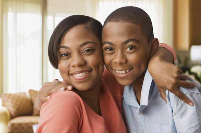 mother & son hugging & smiling brightly I dentist decatur il