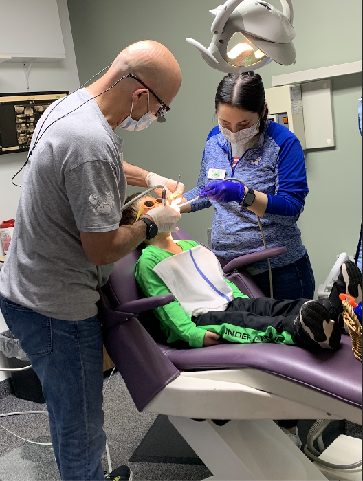 Child undergoing dental cleaning in Decatur, IL