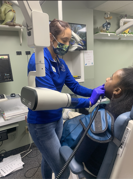 Kid undergoing dental cleaning in Decatur, IL