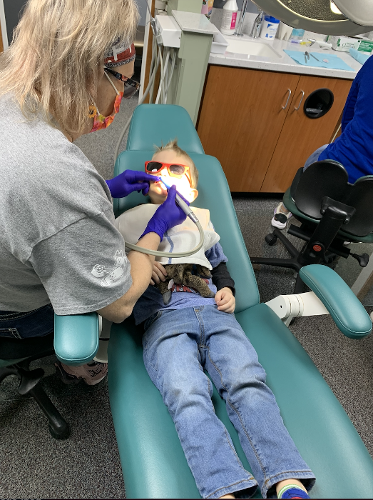 Kid undergoing dental cleaning in Decatur, IL