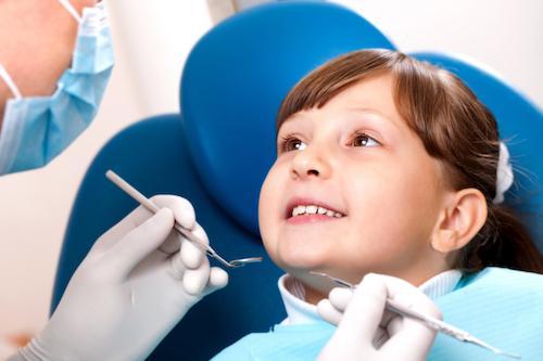 Girl undergoing dental examination in Decatur, IL