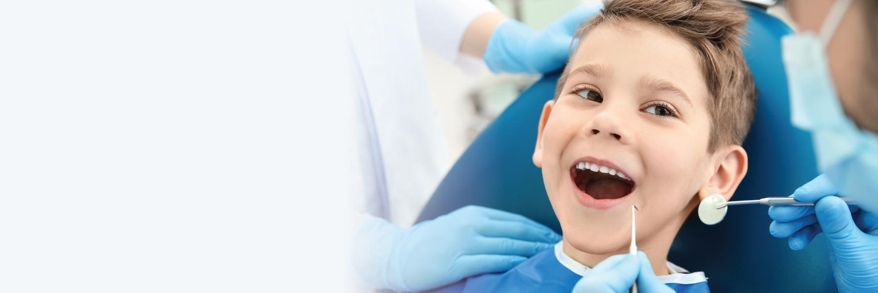 Young boy undergoing dental examination in Decatur, IL