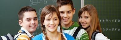 Group of four children at school after pediatric dentistry in Decatur, IL