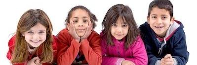 group of four kids smiling after general dentistry in Decatur, IL