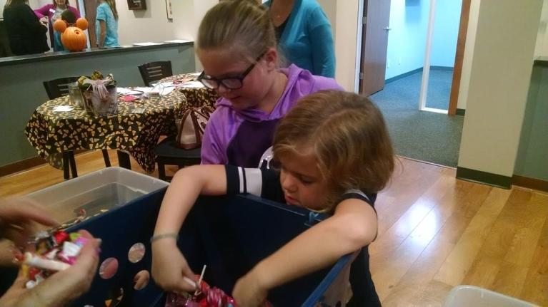 Child picking Halloween candy in Decatur, IL