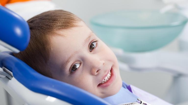 Child smiling after Emergency Dentistry treatment at Jerger Pediatric Dentistry