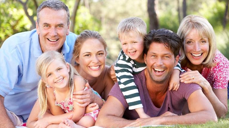 Happy family smiling after dental treatment in Decatur, IL