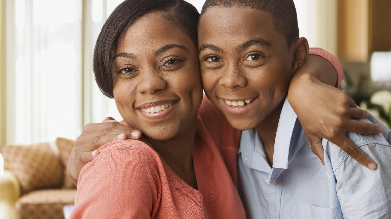 Mother and son hugging after dental examination in Decatur, IL