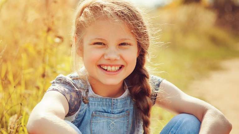 Child smiling after getting sealants from Jerger Pediatric Dentistry