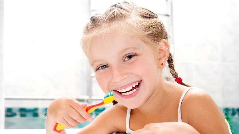 young girl brushing teeth | pediatric dentist decatur il