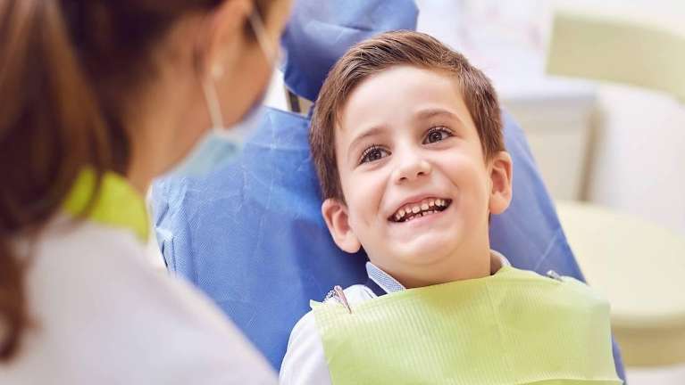 Kid smiling during a dental emergency check up at Jerger Pediatric Dentistry