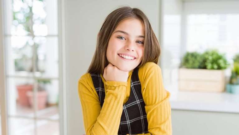 Baby smiling after getting braces in Decatur, IL