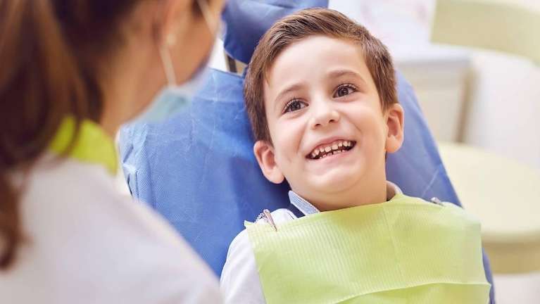 Baby smiling during an emergency check up in Decatur, IL