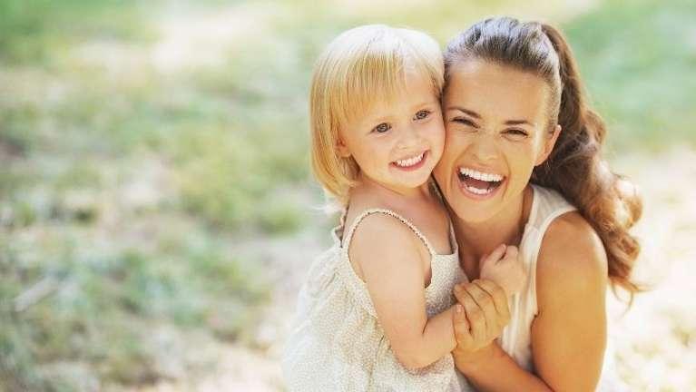 Mother and kid smiling after general dentistry session at Jerger Pediatric Dentistry