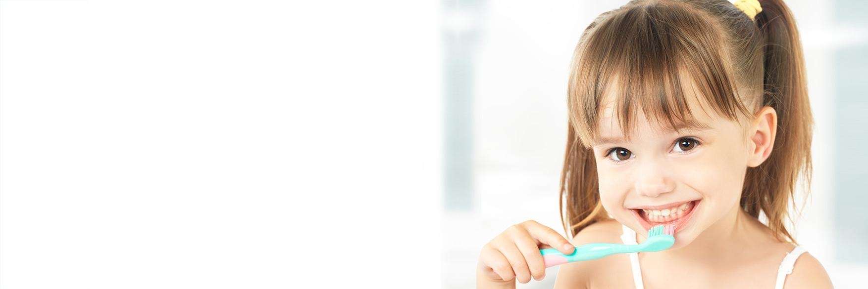 Child brushing her teeth in Decatur, IL